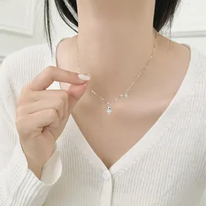 S925 sterling silver bear pendant necklace with sparkling zircons on a female model