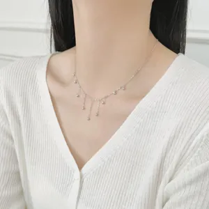 Elegant S925 sterling silver beaded tassel necklace worn by a model on white background
