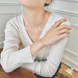 Elegant S925 sterling silver beaded tassel necklace and bracelet set on a model