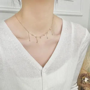 Elegant S925 sterling silver beaded tassel necklace worn on a white knit sweater
