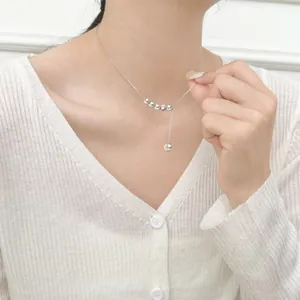 Elegant S925 sterling silver necklace featuring cat eye beads and a tassel drop chain