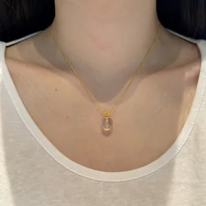 S925 sterling silver lotus necklace with crystal pendant and ruby detail on model