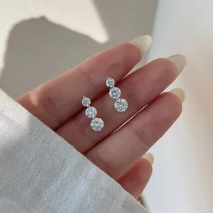 S925 sterling silver moissanite earrings featuring a gradient of three round stones