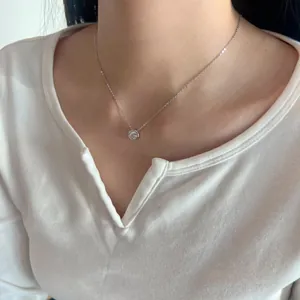 Minimalist S925 sterling silver necklace with a round bezel-set moissanite pendant