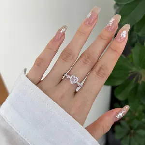 Close-up of S925 sterling silver ring with heart-shaped pink zircon and micro-set diamonds