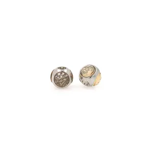 Macro detail of 18K gold plated bead charms with micro-pave zircon for DIY bracelets