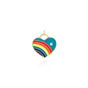 Macro detail of 18K gold-plated rainbow enamel heart pendant with zircon stone inlay
