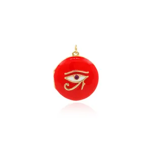 Macro shot of 18K gold plated evil eye pendant with red enamel and zircon inlay detail