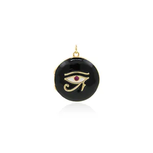 Macro detail of 18K gold-plated Eye of Horus locket pendant with enamel and zircon inlay