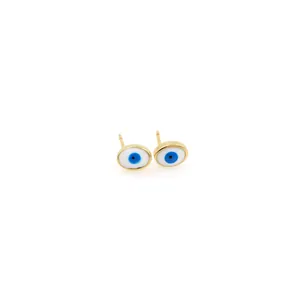 Macro detail of 18K gold-plated Evil Eye stud earrings with blue enamel center