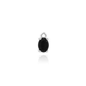Macro shot of silver oval black gemstone pendant with four-claw setting on white background