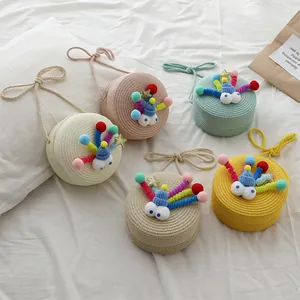 Bolsos bandolera redondos de paja para niñas en cinco colores con ojos de dibujos animados