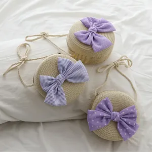 Borse a tracolla rotonde in paglia per bambini con fiocchi decorativi viola
