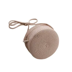 Bolso bandolera redondo de paja tejida para niñas con textura espiral y cremallera