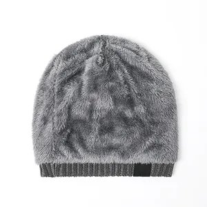 Detail of gray winter beanie showing thick plush fleece lining and ribbed knit texture