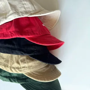 Close-up of cotton soft brim baseball caps showing twill fabric texture in five colors