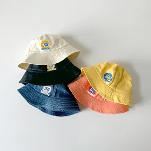 Kids cotton sun hat with holiday print in five colors including cream and denim blue