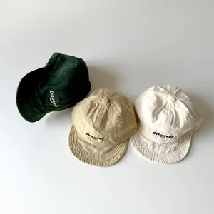 Toddler cotton baseball caps with Discover embroidery in green, beige and cream