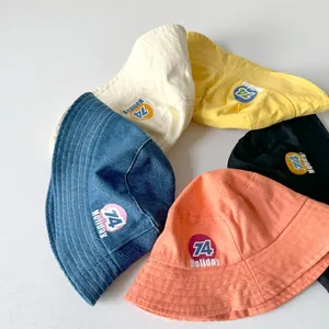 Kids vintage bucket hats in five colors with 74 Holiday patch for sun protection
