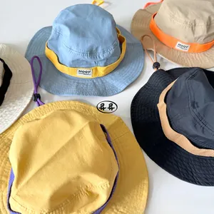 Detail of outdoor sun hats for kids featuring wide brims and adjustable windproof drawstrings