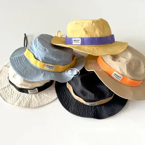 Selection of colorful kids outdoor sun hats with adjustable straps and wide brims