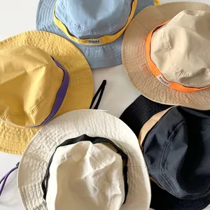 Top view of multi-color children's cotton sun hats with adjustable straps and logo detail