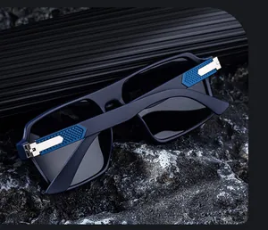 Detail of square polarized sunglasses featuring blue diamond texture arms and metal hinges