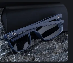 Detail of blue square polarized sunglasses with H metal logo and leather folding case