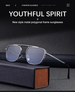 Détail de lunettes de soleil polygonales en métal gris avec double pont et branches
