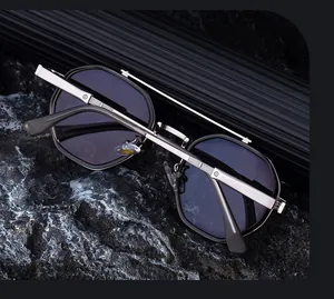 Detailed view of silver metal double bridge with vertical stripe engraving on sunglasses