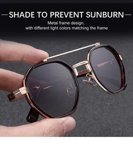Detailed macro of golden octagonal metal frame sunglasses with vintage double bridge design