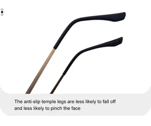 Détail des branches de lunettes dorées avec embouts noirs antidérapants et texturés