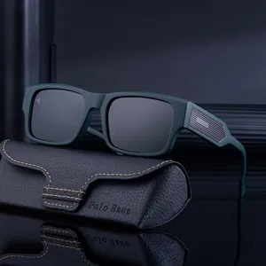Green polarized square frame sunglasses for men with a leather case on a reflective surface