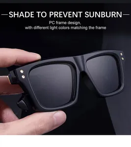 Detail view of square black sunglasses with metal rivets on PC frame and dark lenses