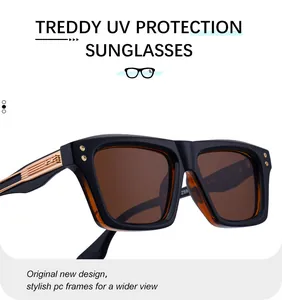 Detailed close-up of square sunglasses with gold metal temple accents and brown lenses