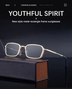 Detail of square gold metal sunglasses frame with textured temples on leather case