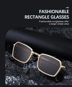 Detail of vintage square metal sunglasses with knurled gold frames and dark lenses