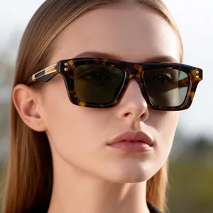 Close-up of tortoise shell square sunglasses with dark lenses and metallic hinge detail