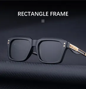 Detail of black rectangle frame sunglasses with golden metal relief on the temples