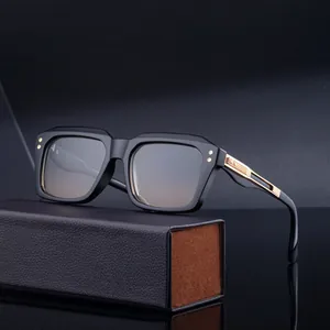 Square polarized sunglasses for men with gold metal accents and leather storage case