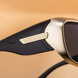 Detail of matte gold metal trim and black temples on stylish sports sunglasses