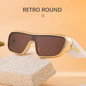 Detail of retro sports sunglasses with golden frames and polarized brown lenses
