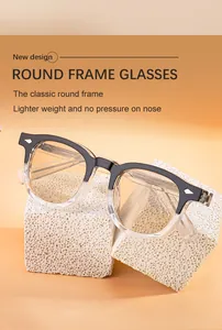 Detail view of lightweight round frame sunglasses with gradient black and clear frames