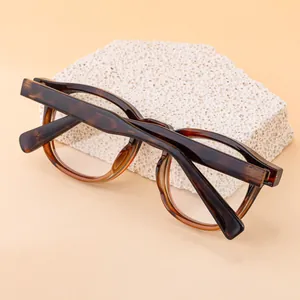Detailed view of square acetate sunglasses frame with retro tortoiseshell texture