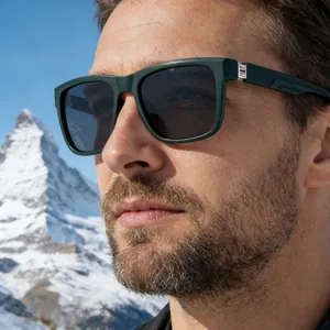 Detail of green square polarized sunglasses with silver metal hinge on outdoor model