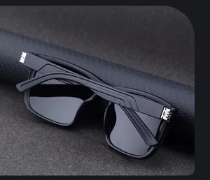 Macro detail of black square sunglasses featuring textured temples and silver metal hinges