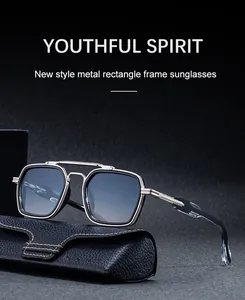 Detail of square double-bridge sunglasses in silver metal with a premium leather case