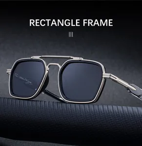 Close-up of rectangle frame sunglasses with double bridge and textured metal finish