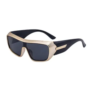 Futuristic gold matte wrap around sports sunglasses with oversized black lenses