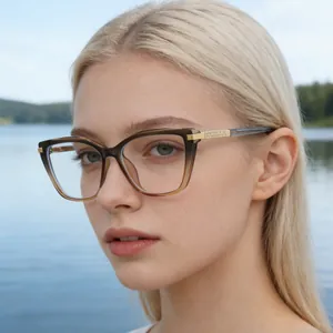 Chic cat-eye optical glasses with brown gradient frames worn by a female model outdoors